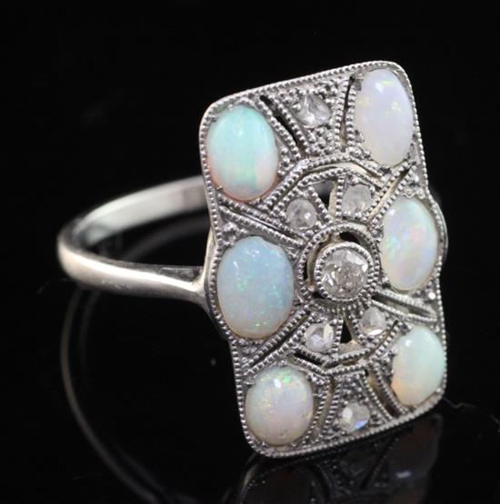 A 1920s platinum, white opal and rose cut diamond set tablet ring, size O.